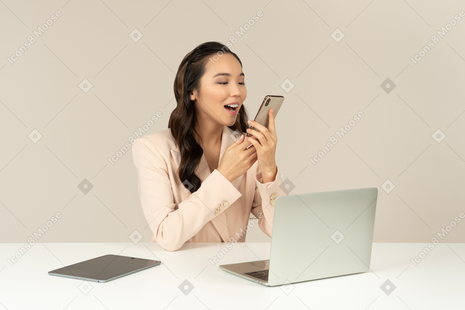 Asian female office worker shouting to smartphone
