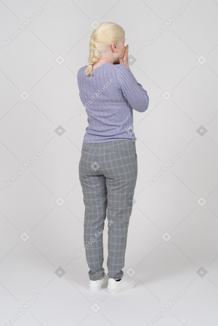 Young woman covering face