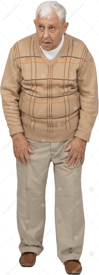 Front view of an impressed old man in casual clothes