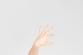 Female hand showing kind of scary gesture