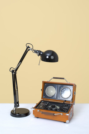 Desk lamp and retro player on table