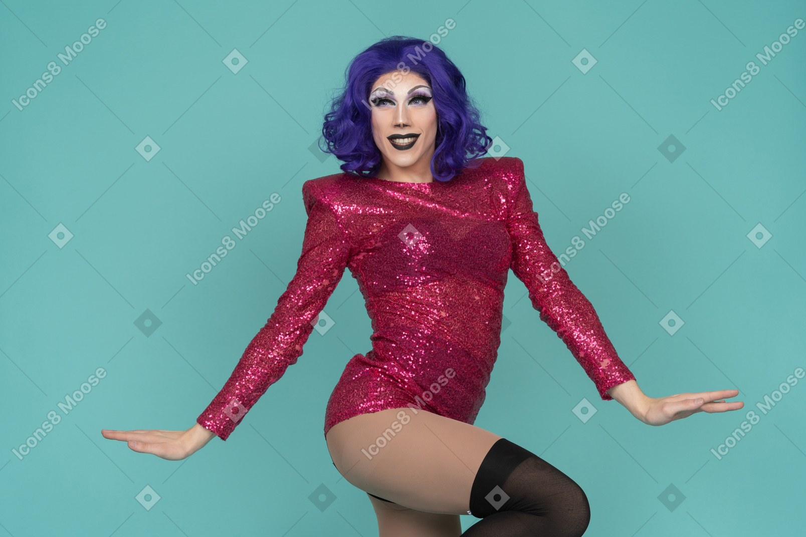 Portrait of a drag queen raising hip while twirling around