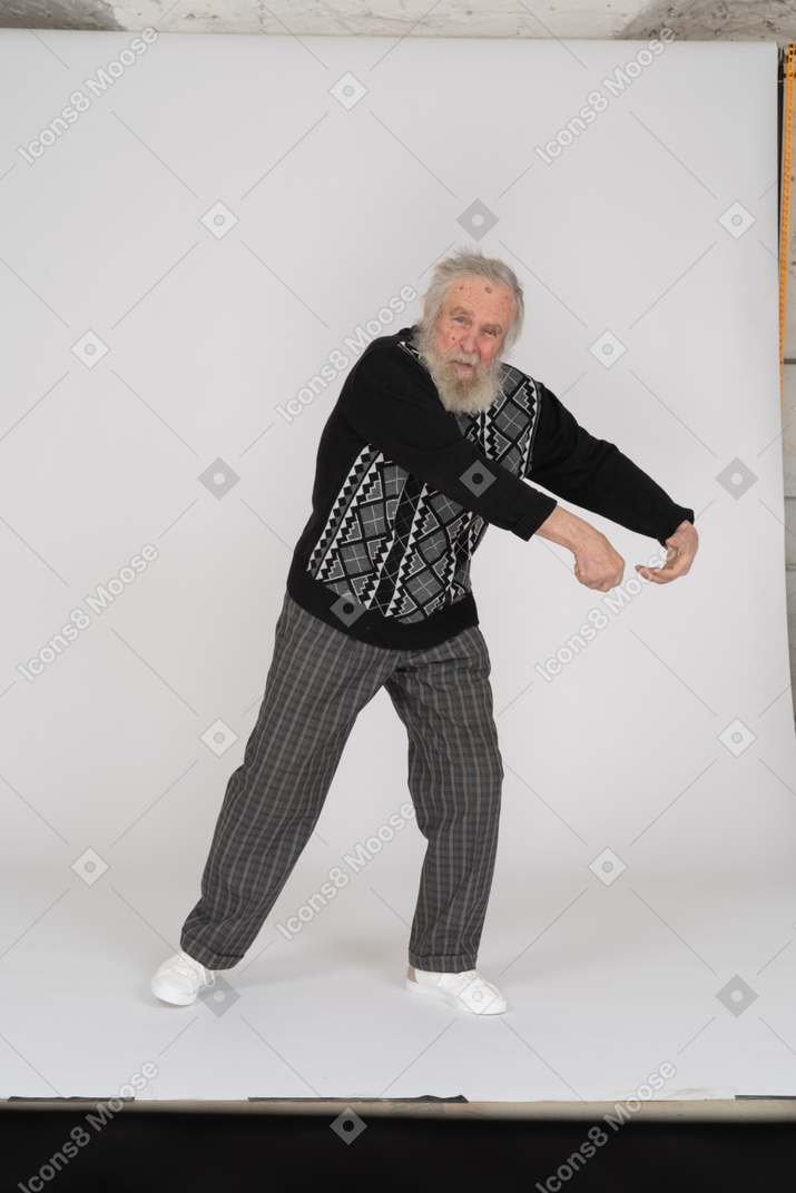 Old man pretending to grab someting
