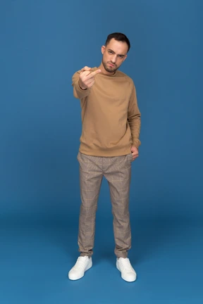 Man doing obscene gestures