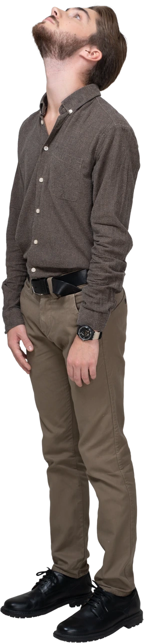 Three-quarter view of a young man in office clothing looking down