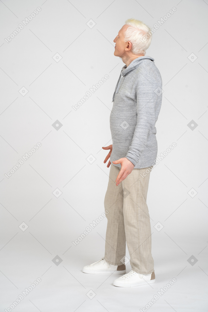 Side view of a man looking up and asking something