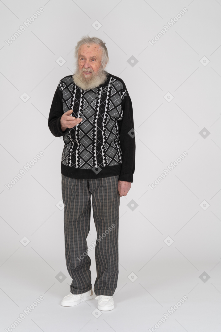 Front view of an elderly man making an inviting gesture