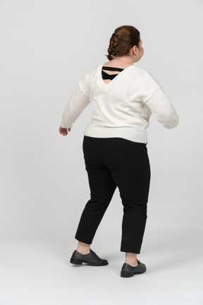 Plus size woman in casual clothes moving