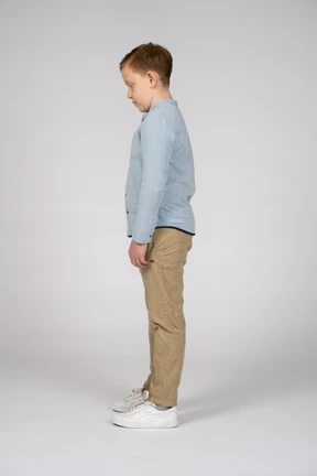 Side view of a boy looking down