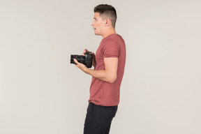 Young guy taking photos with a camera