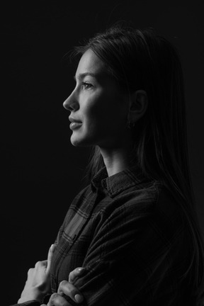 Black and white photo of woman with crossed arms