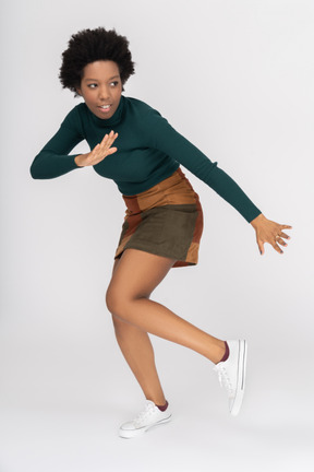 Confident african-american teenage girl practicing martial arts