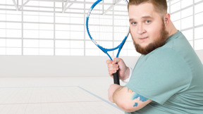A man with a beard holding a tennis racket