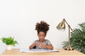 Good looking cute girl with books at the table