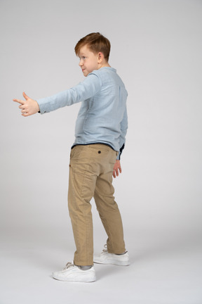 Boy pointing at something interesting