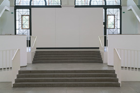 Spacious hallway with stairs leading upstairs