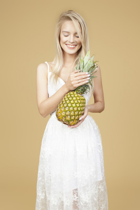 Beautiful bride holding a pineapple