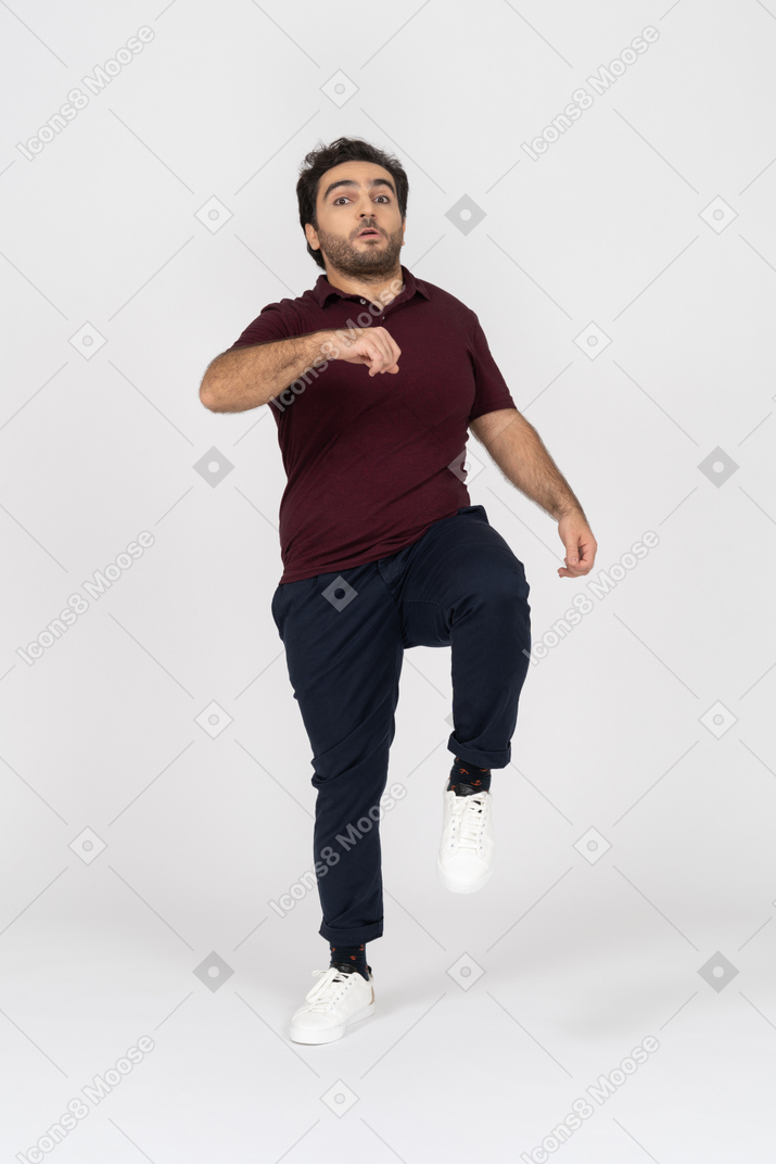 Man in casual clothes running fast