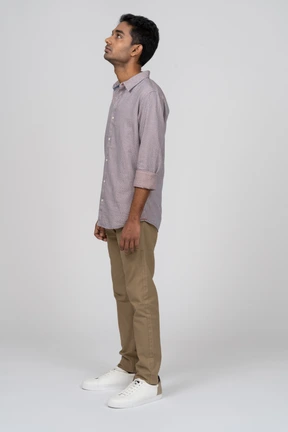 Young man in casual clothes standing