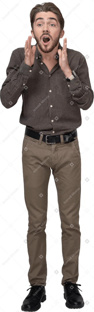 Front view of an emotional gesticulating young man in office clothing