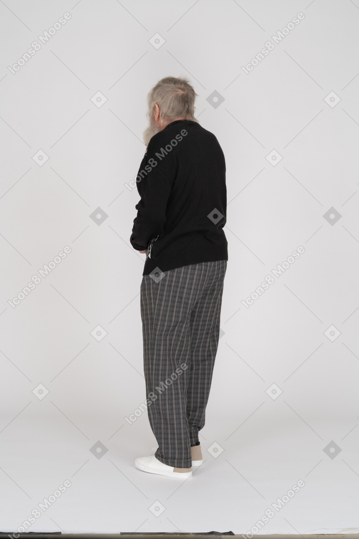 Rear view of elderly man standing still