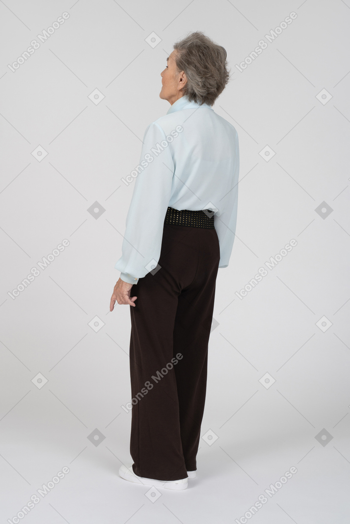 Three quarter view of old lady in black pants