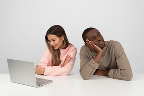 Attractive couple watching some show online together