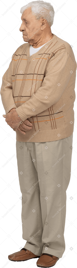Old man in casual clothes standing still