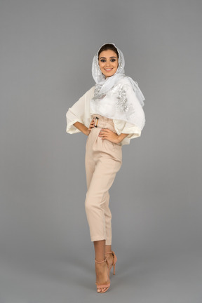 Portrair of a smiling confident young woman wearing white headscarf