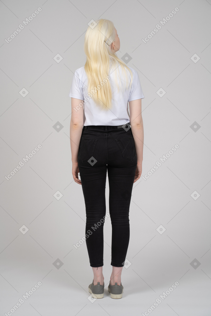 Back view of a long-haired girl in casual clothes