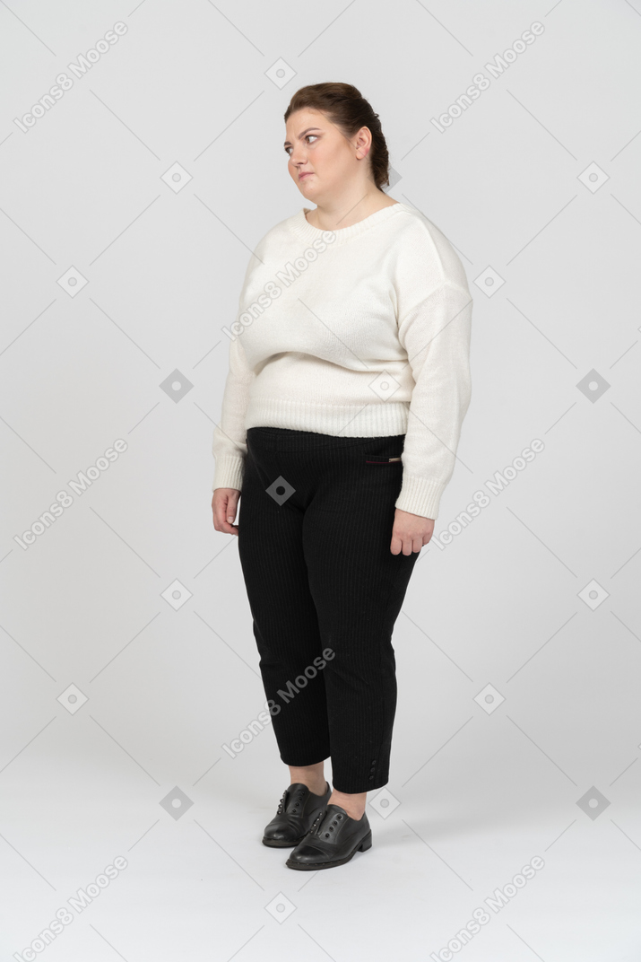 Upset plus size woman in white sweater