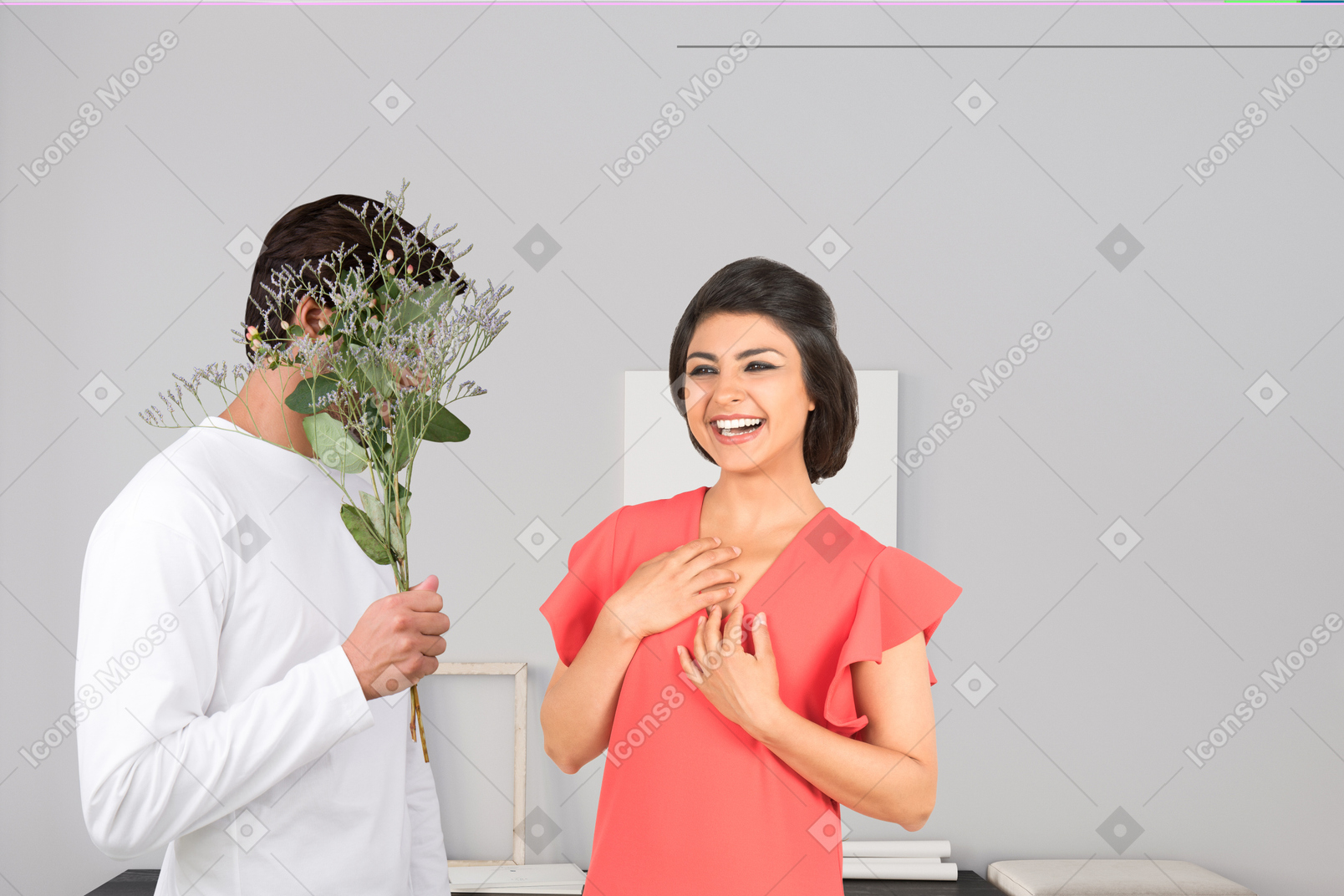 A man standing next to a woman holding a bouquet of flowers