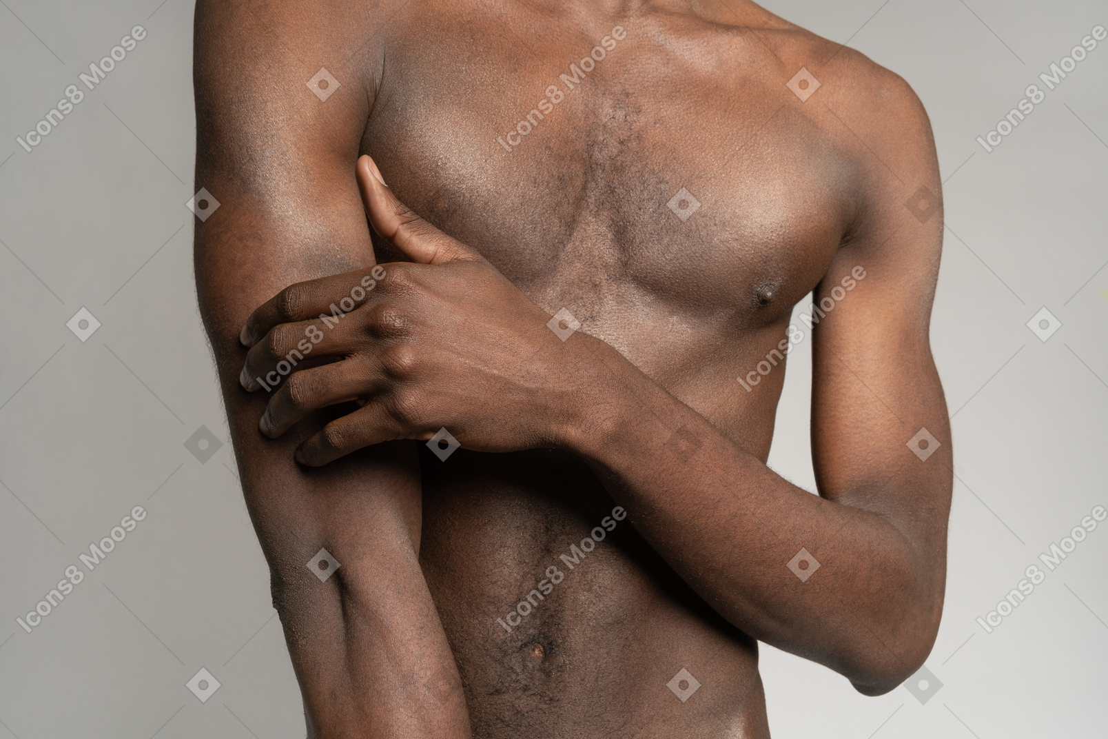 Man's naked torso with hand