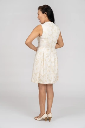 Woman in a white dress standing