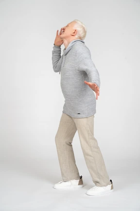 Side view of a middle-aged man shouting