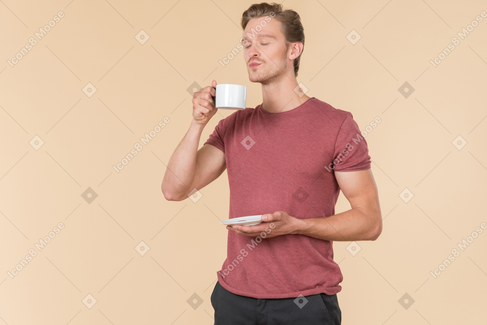 Young guy tasting coffee with his eyes closed