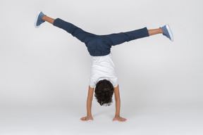 A boy standing on hands