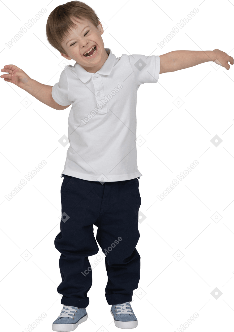 Front view of a boy fooling around and smiling happily