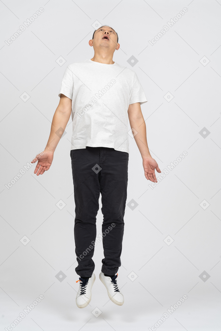 Man jumping with outstretched arms