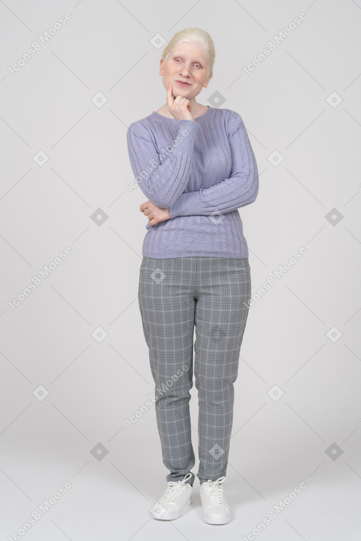 Young woman thinking of something nice