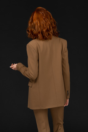 Back view of a woman in a suit