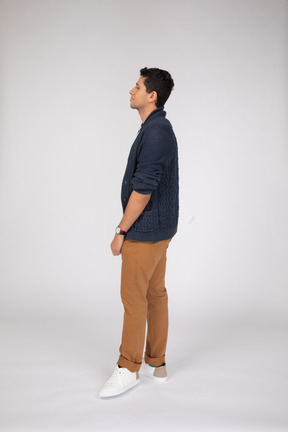 Profile of young man in casual clothes standing