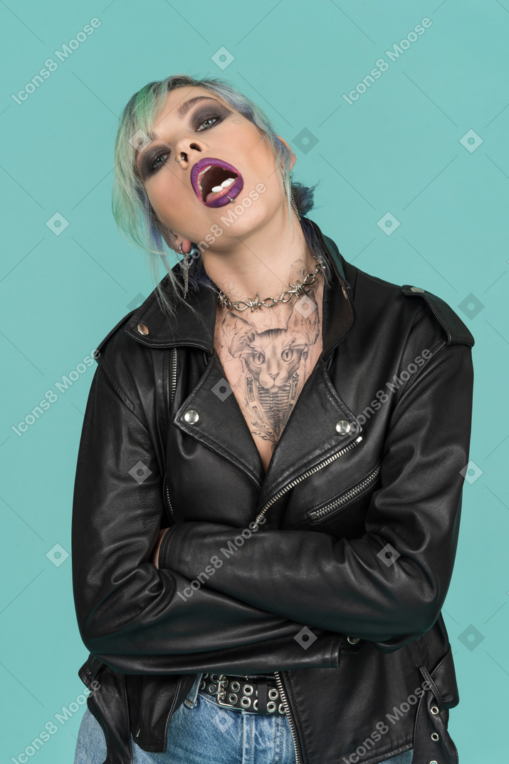 Punk woman crossing hands on her chest and making faces