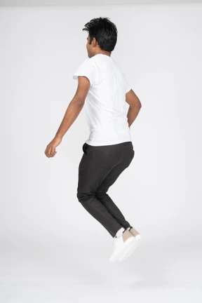 Man in white t-shirt jumping