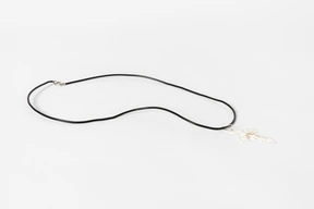 Cross necklace on white background