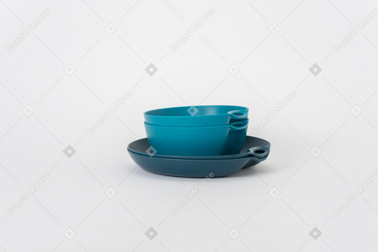 Stack of plastic tableware on a white background