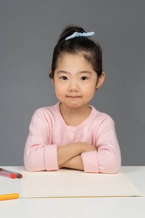 Cheerful asian girl is ready to draw a picture