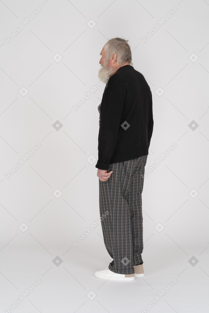 Rear view of an old bearded man standing