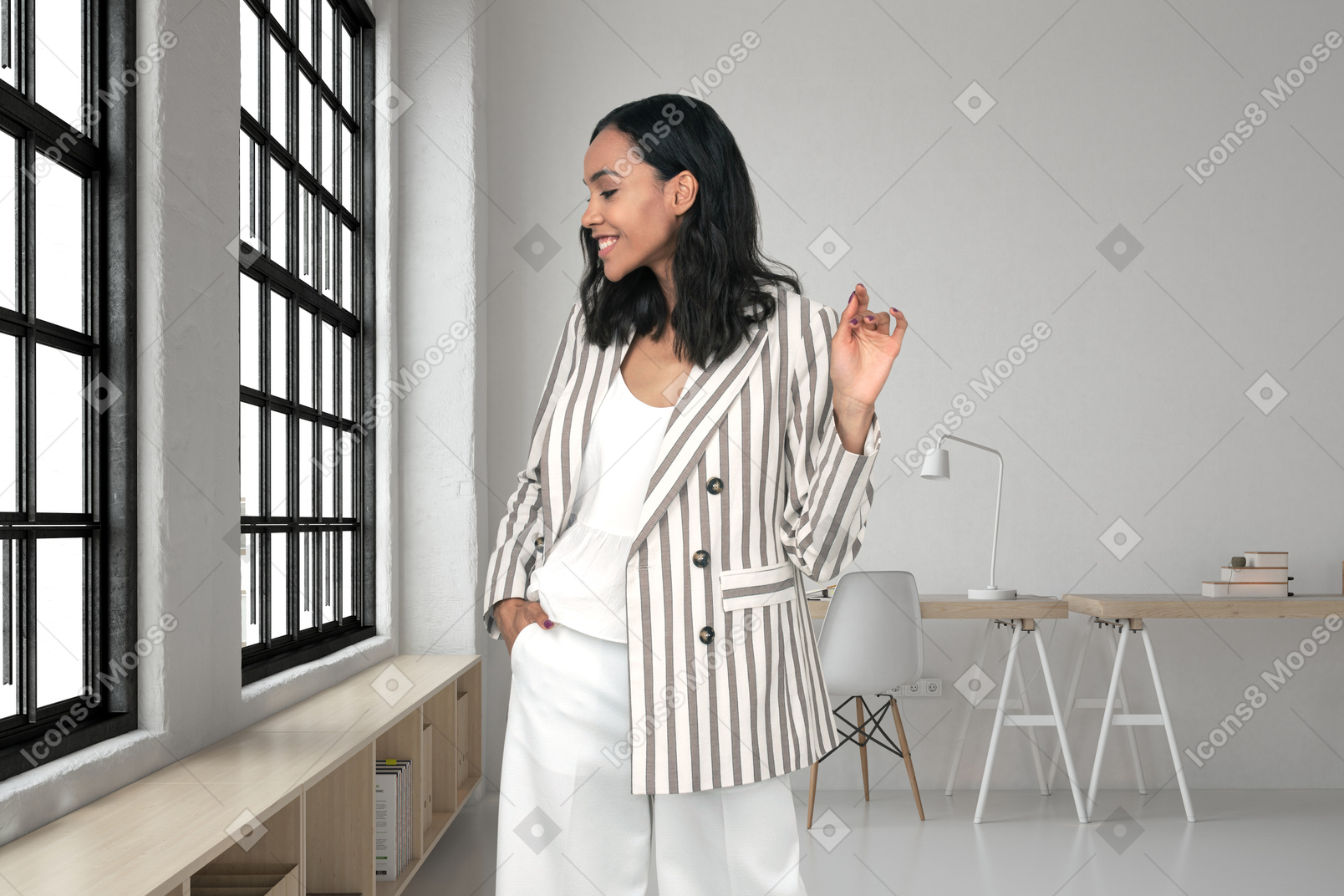 A woman standing in front of a window in a room