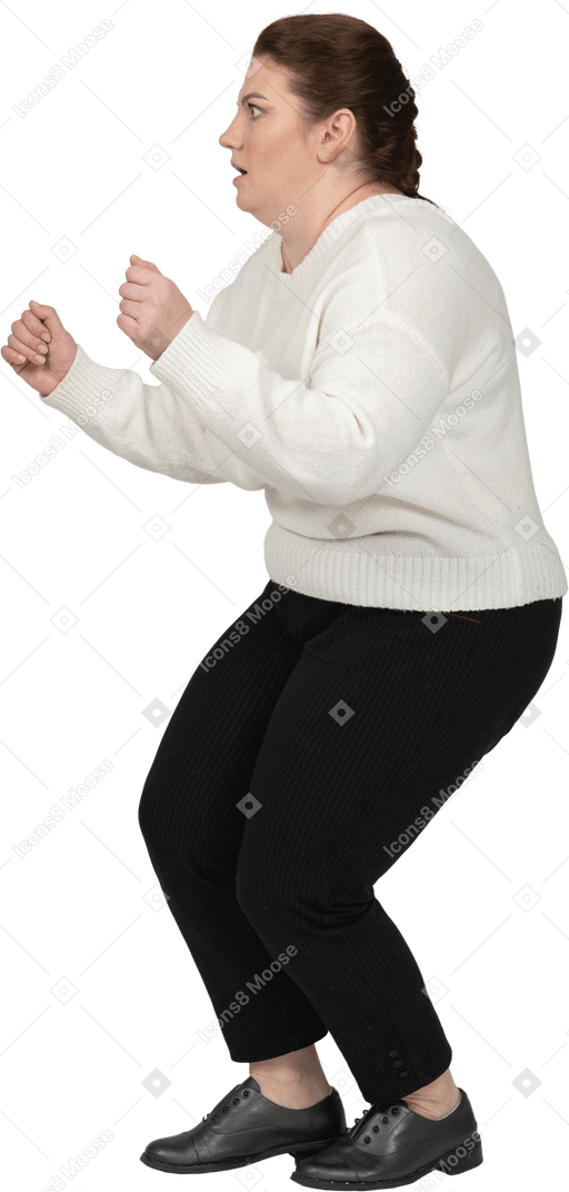 Plus size woman in casual clothes posing